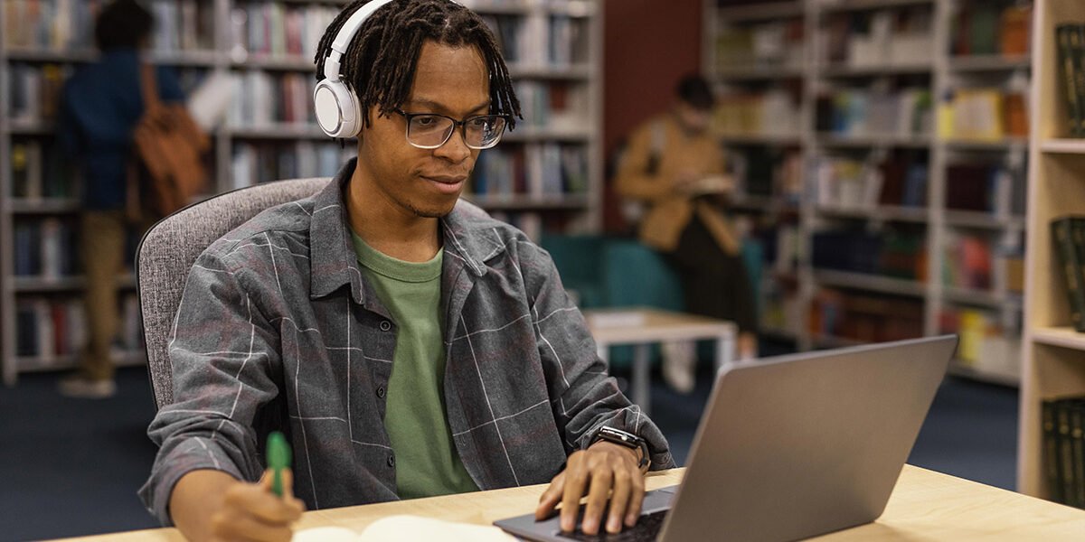 boy-studying-university-library